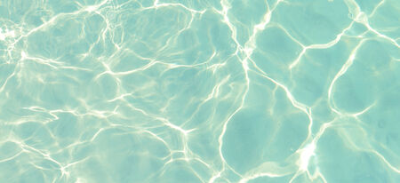 Reflections on a surface of a water in the seaの写真素材