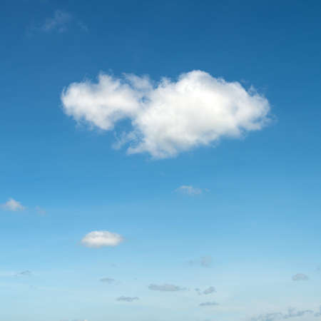 The blue sky and white fluffy clouds の写真素材