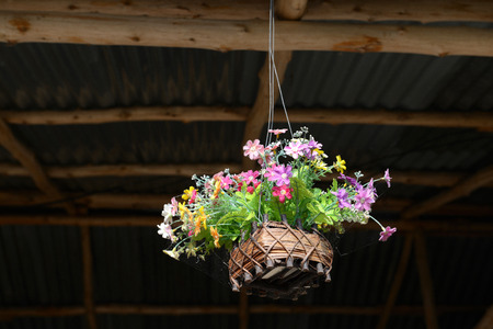 fake flower varicolored in hanging basket for decorative homeの写真素材