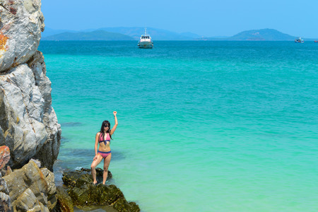 PHANG NGA,THAILAND - MARCH 24 :  Beautifull tourist woman poses for photographers on the beach in summer vacations at Khai Nok island. - 24 March 2015, Phang Nga, Thailandのeditorial素材