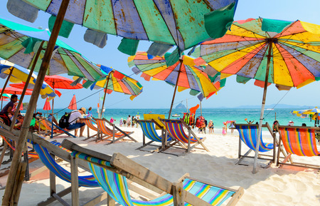 PHANG NGA,THAILAND - MARCH 24 :  People relaxing, Beach chairs and colorful umbrella on the tropical beach in sunny day, at Khai Nok island. - 24 March 2015, Phang Nga, Thailandのeditorial素材