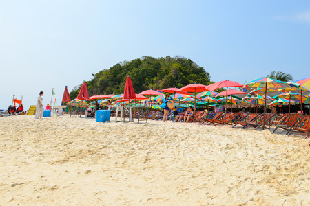 PHANG NGA,THAILAND - MARCH 24 :  People relaxing, Beach chairs and colorful umbrella on the tropical beach in sunny day, at Khai Nok island. - 24 March 2015, Phang Nga, Thailandのeditorial素材