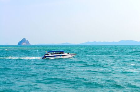 PHUKET, THAILAND - MARCH 24 : Speedboat navigating on blue water of Andaman Sea in summer at Phuket island. - 24 March 2015, Phuket , Thailand.のeditorial素材