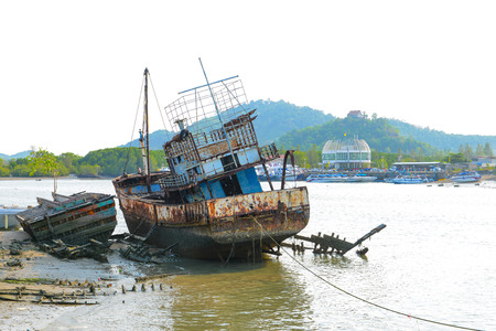 The old ship was left on the shore side, Phuket, Thailandの写真素材
