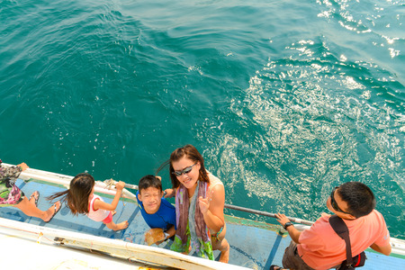 Mother and children are going to dive in summer vacation at Khai Nok island, Phang Nga, Thailandの写真素材
