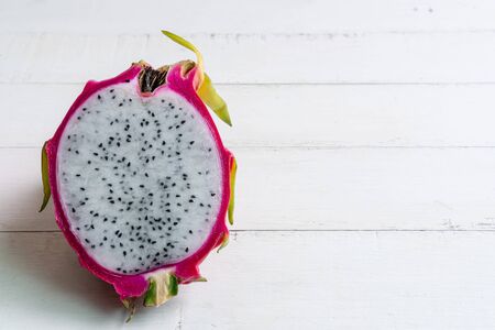 Fresh dragon fruit on white wooden backgroundの写真素材