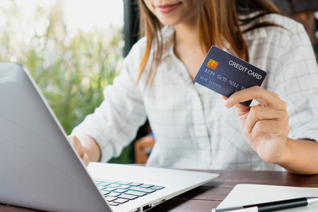 Asian woman wearing medical mask and wash her hands during the coronavirus crisis. Wear a mask in public places and wash your hands to prevent the transmission of virus concept.の写真素材