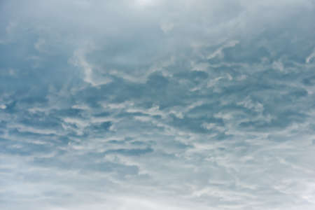 under clouds in the sky before the stormの写真素材