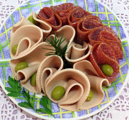 Extra cooked sausage and smoked sausage with olives の写真素材