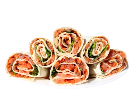 rolls filled with smoked salmon, cheese, lemon, tomato, dill and parsley in lavashの写真素材