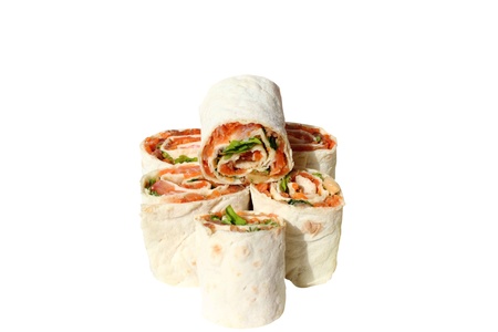 rolls filled with smoked salmon, cheese, lemon, tomato, dill and parsley in lavashの写真素材