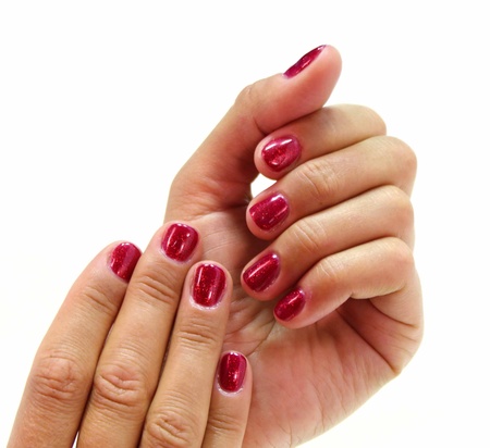 two women hands with red nails on a white background の写真素材
