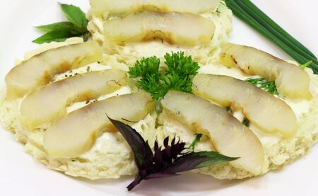 this is a sandwiches with white bread and smoked fish の写真素材