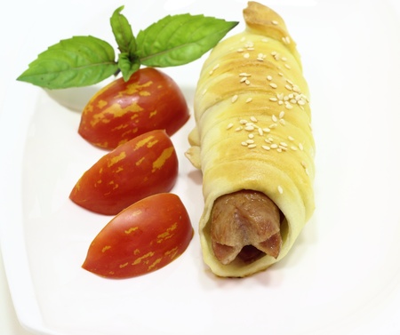 This is the sausage in dough white plateの写真素材