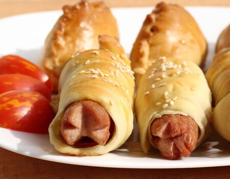 This is the sausage in dough white plateの写真素材