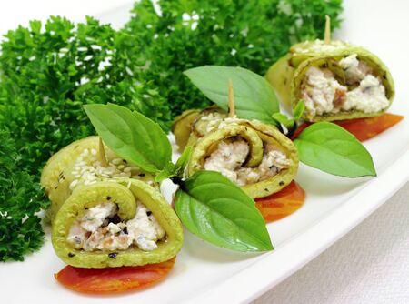 Zucchini roll with cottage cheese and herbsの写真素材