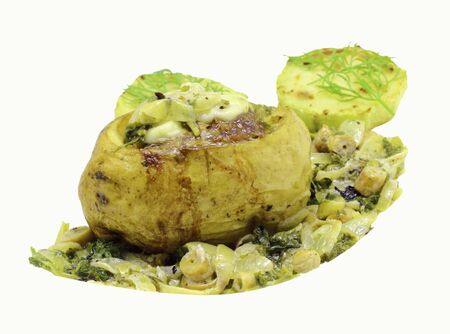 Stuffed potatoes with braised mushroom sauce and grilled zucchini on a white backgroundの写真素材