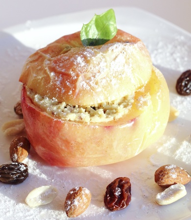 Baked apple with curds , nuts and raisins fillings の写真素材