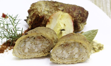 Meat rolls rolled shape and is made from thin slices of pork that is seasoned with salt and pepper and stuffed with baconの写真素材