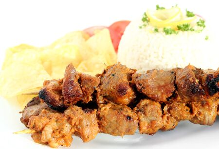 Pork skewers , served with rice and lemonの写真素材