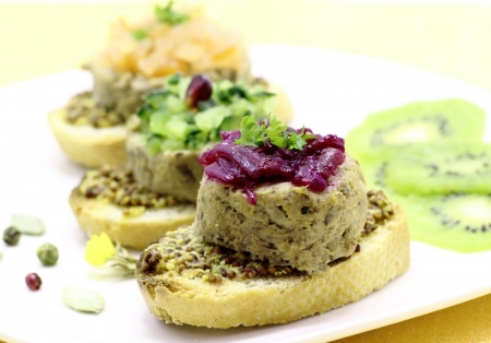 Liver pate served with pieces of chopped vegetables capsの写真素材