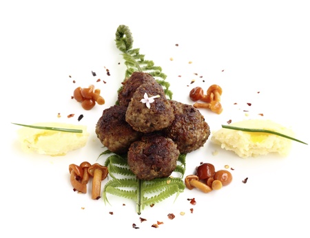 roast rissoles served with mashed potatoes and marinated mushroomsの写真素材