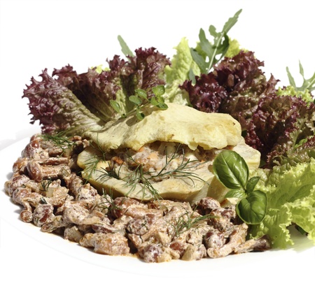 patisson stuffed with minced meat, served with vegetables and openky mushroom sauceの写真素材