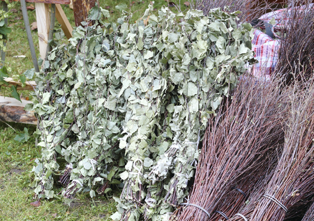 This is a handmade rustic birch broomsの写真素材