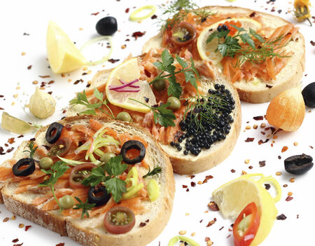 Appetizing sandwiches with smoked salmon and vegetablesの写真素材