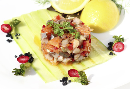 herring salad with smoked salmon and vegetablesの写真素材