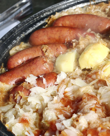 Close up of smoked sausage with stewed cabbageの写真素材
