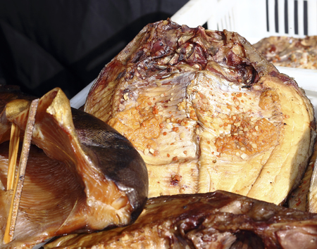 Close up freshly smoked fish in marketの写真素材
