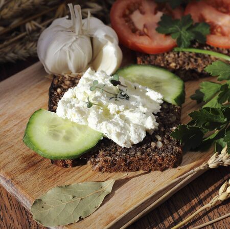 Cottage cheese sandwich with whole grain bread and vegetablesの写真素材