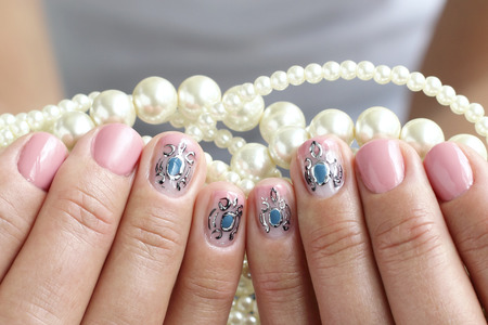 Female hands, nails with beautiful art manicureの写真素材