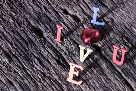 Valentines Day background,I love you alphabet wood on wood background.の写真素材
