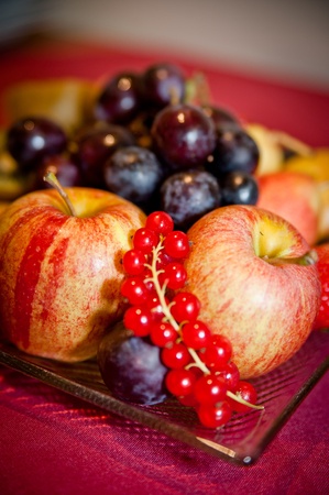 Plate with some Fruits like Apple, Grapes and Redcurrantの写真素材