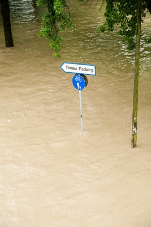 High Water on the Danube River and Signの写真素材