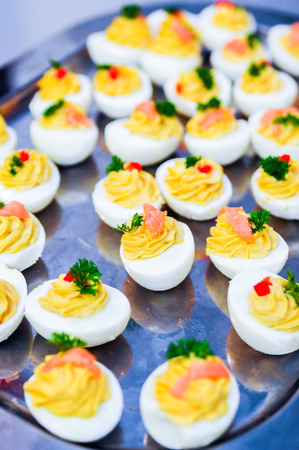 Lot of stuffed Eggs on a silver plateの写真素材