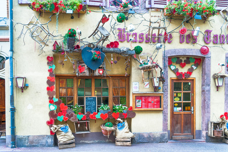 decorated facade of a restaurant in alsace, franceの写真素材