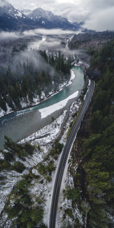 Tall colorful wilderness backroad drone shot in Washington State