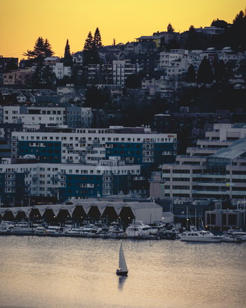 Summer boating trip across Lake Union by Seattle buildingsの写真素材