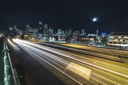 Wide angle long exposure photography in downtown metropolis at nightの写真素材