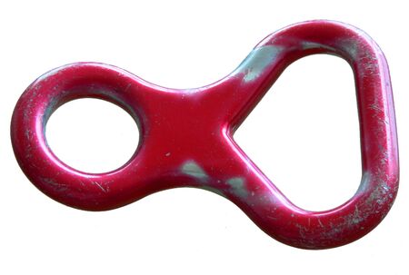 A red figure eight descender. Worn from use. Isolated on white.の写真素材