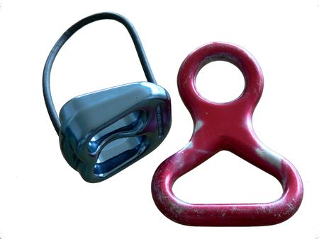 A blue ATC and red figure eight descender. Isolated on white. の写真素材