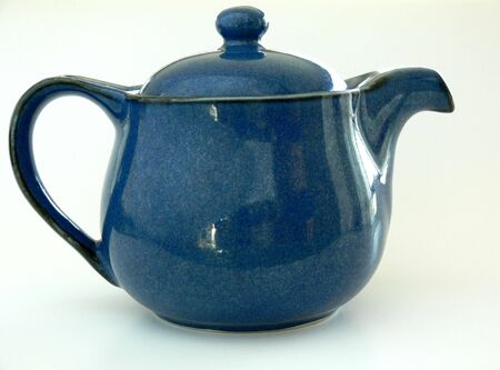 A blue teapot. Isolated on whiteの写真素材
