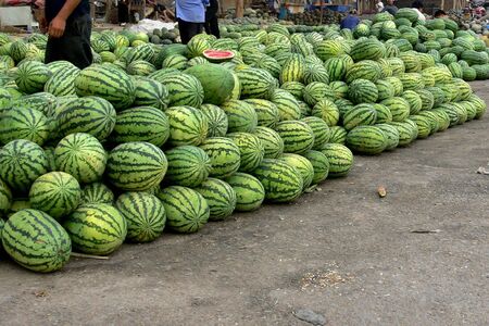 Watermelons piled high at an outdoor market. Kashgar, Xinjiang Uygur Autonomous Region, Chinaの写真素材