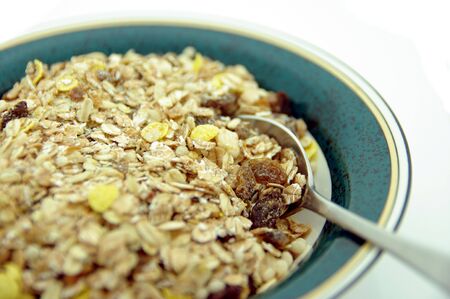 A bowl of healthy breakfast cereal. High key shot with shallow depth of field.
