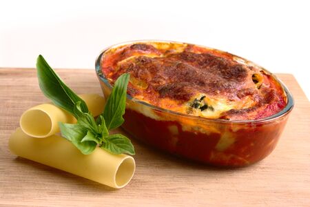 Cannelloni pasta with napoli and bechamel sauces. Baked golden brown and ready to eatの写真素材