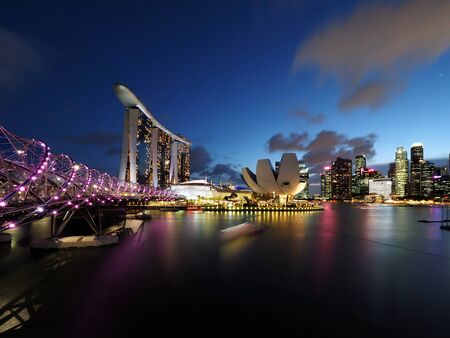 Marina Bay, including the Helix Bridge, Marina Bay Sands,ArtScience Museum and the glittering Singapore City skyline.のeditorial素材