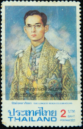 A stamp printed in Thailand shows portrait of Bhumibol Adulyadej Rama IX of Thailand (glasses), circa 1951-1960のeditorial素材
